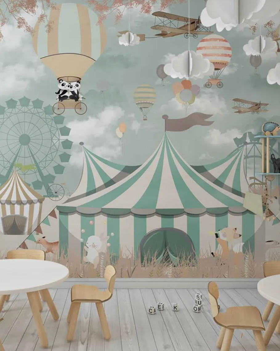 Children's room with a circus-themed wallpaper featuring hot air balloons, a Ferris wheel, and a striped tent.