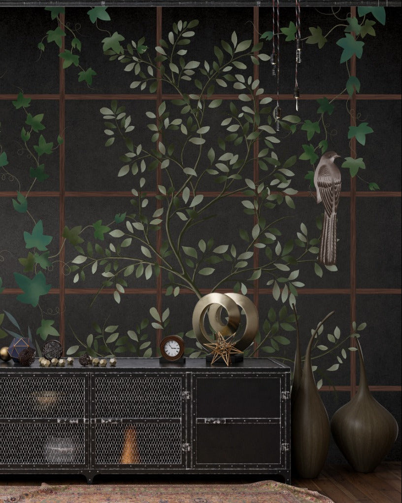 Decorative wall with green leaf patterns and a black console table with decorative items.