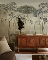 Living room with wooden cabinet against a wall with forest mural