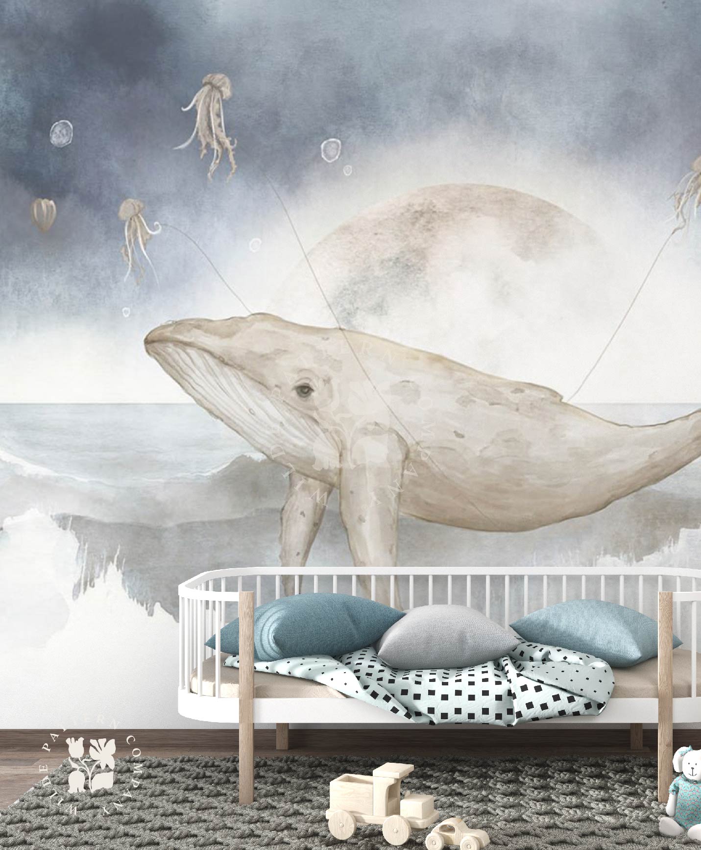 Children's room with a whale mural, crib, and toys.